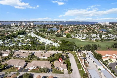 an aerial view of residential building and lake