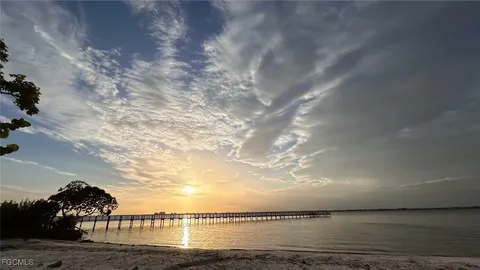 an aerial view of a house with yard swimming pool and outdoor seating
