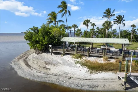 a front view of a house with a yard and porch