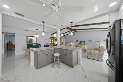 a kitchen with granite countertop stainless steel appliances and sink