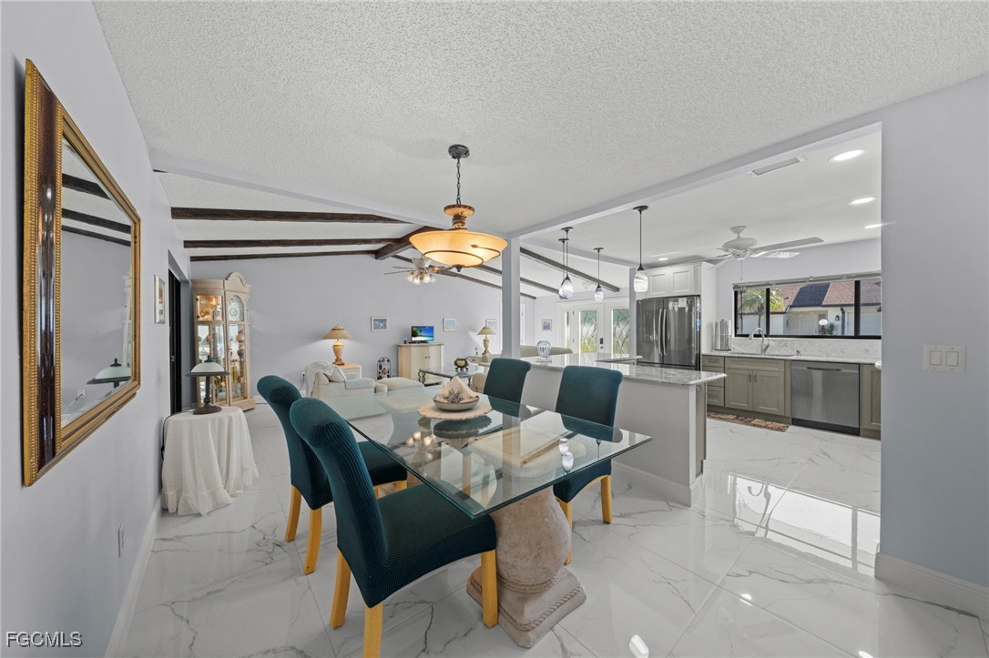 11650 Pointe Circle Fort Myers, FL 33908 - Photo 10 of 40 a dining room with furniture and window