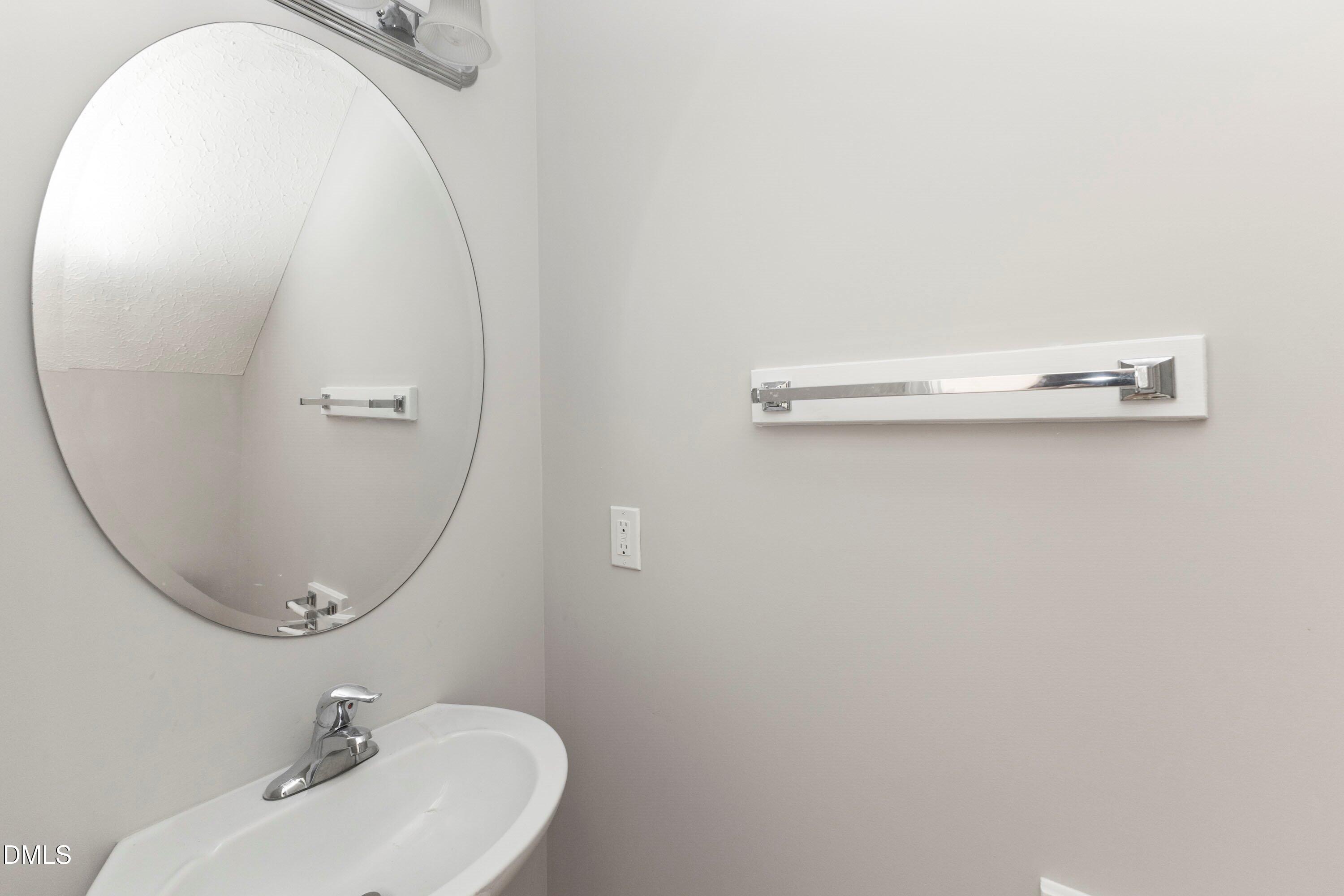 3358 Tarleton West Durham, NC 27713 - Photo 14 of 23 a bathroom with a sink and a mirror