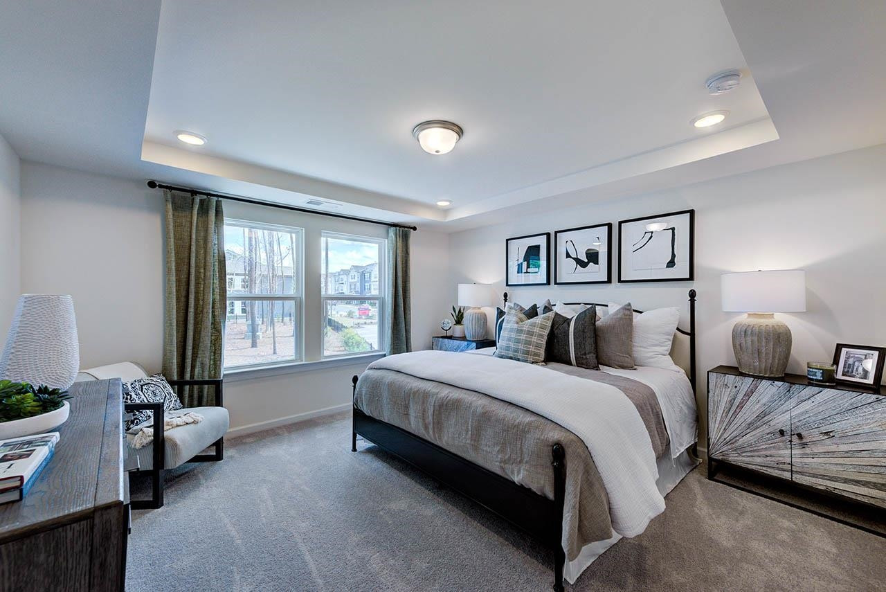 931 Baldwin Rdg Road Apex, NC 27523 - Photo 19 of 42 a bedroom with a bed couch and a window