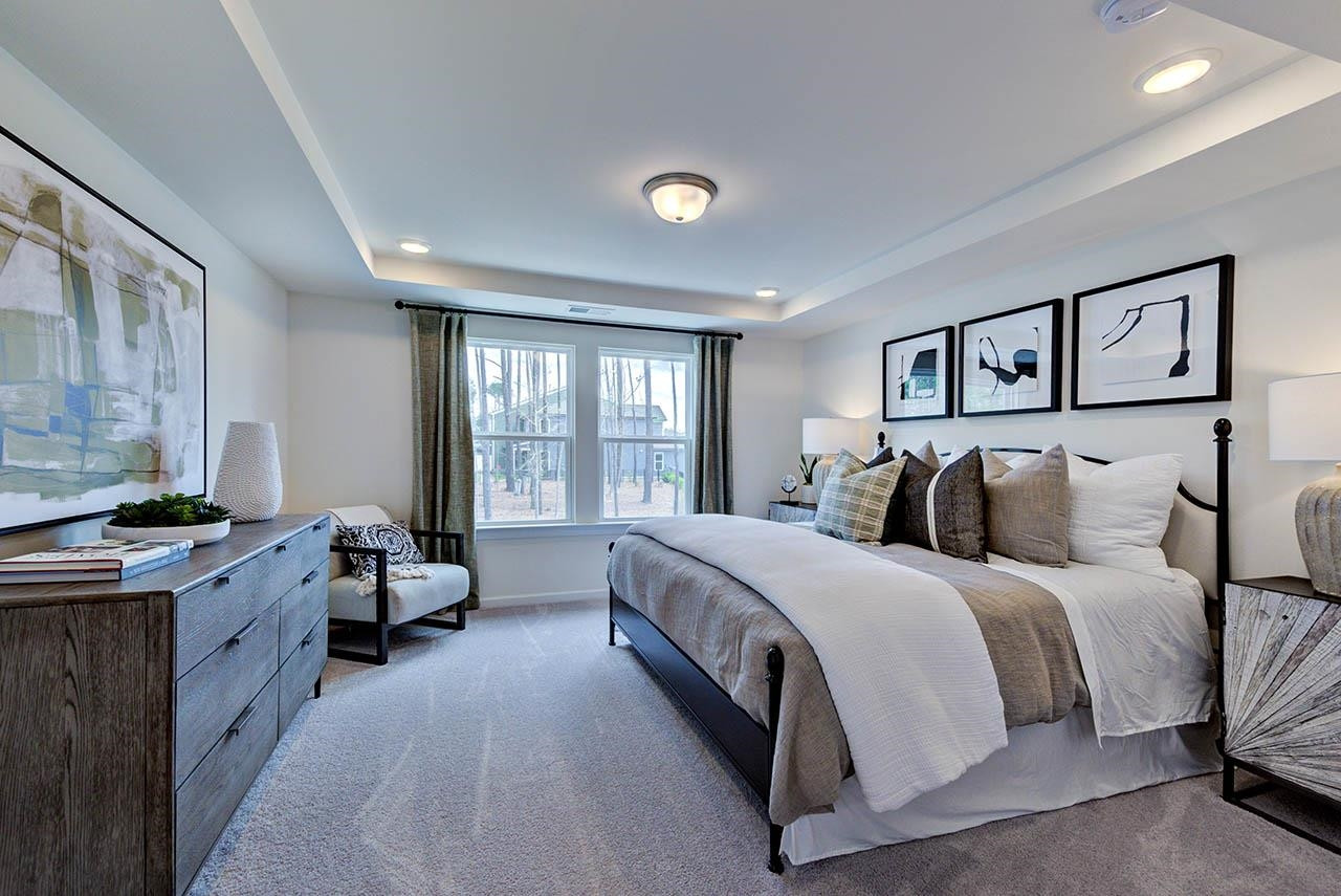 931 Baldwin Rdg Road Apex, NC 27523 - Photo 20 of 42 a bed room with a bed and a couch