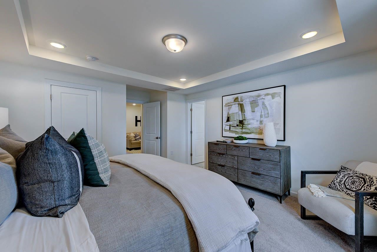 931 Baldwin Rdg Road Apex, NC 27523 - Photo 21 of 42 a bed room with a bed and a dresser