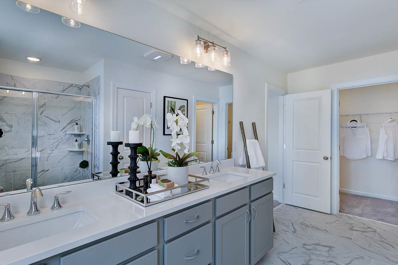 931 Baldwin Rdg Road Apex, NC 27523 - Photo 25 of 42 a bathroom with a sink and a mirror