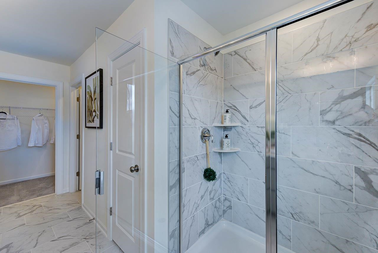 931 Baldwin Rdg Road Apex, NC 27523 - Photo 26 of 42 a bathroom with a bathtub and shower