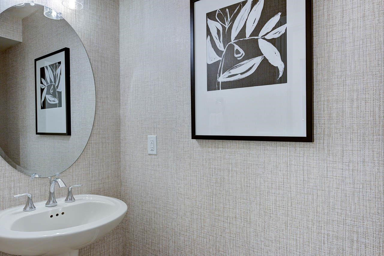 931 Baldwin Rdg Road Apex, NC 27523 - Photo 28 of 42 a bathroom with a sink and mirror