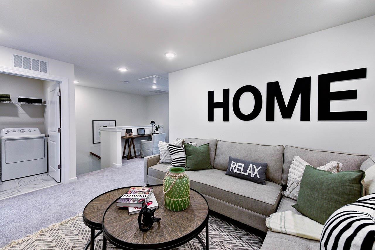 931 Baldwin Rdg Road Apex, NC 27523 - Photo 32 of 42 a living room with furniture and wooden floor