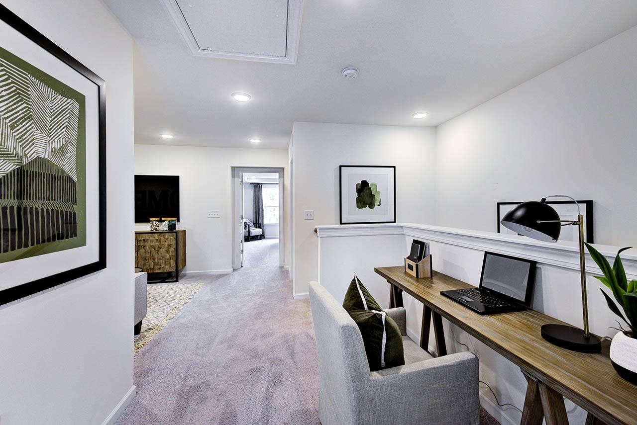 931 Baldwin Rdg Road Apex, NC 27523 - Photo 35 of 42 a view of a hallway with workspace and a window