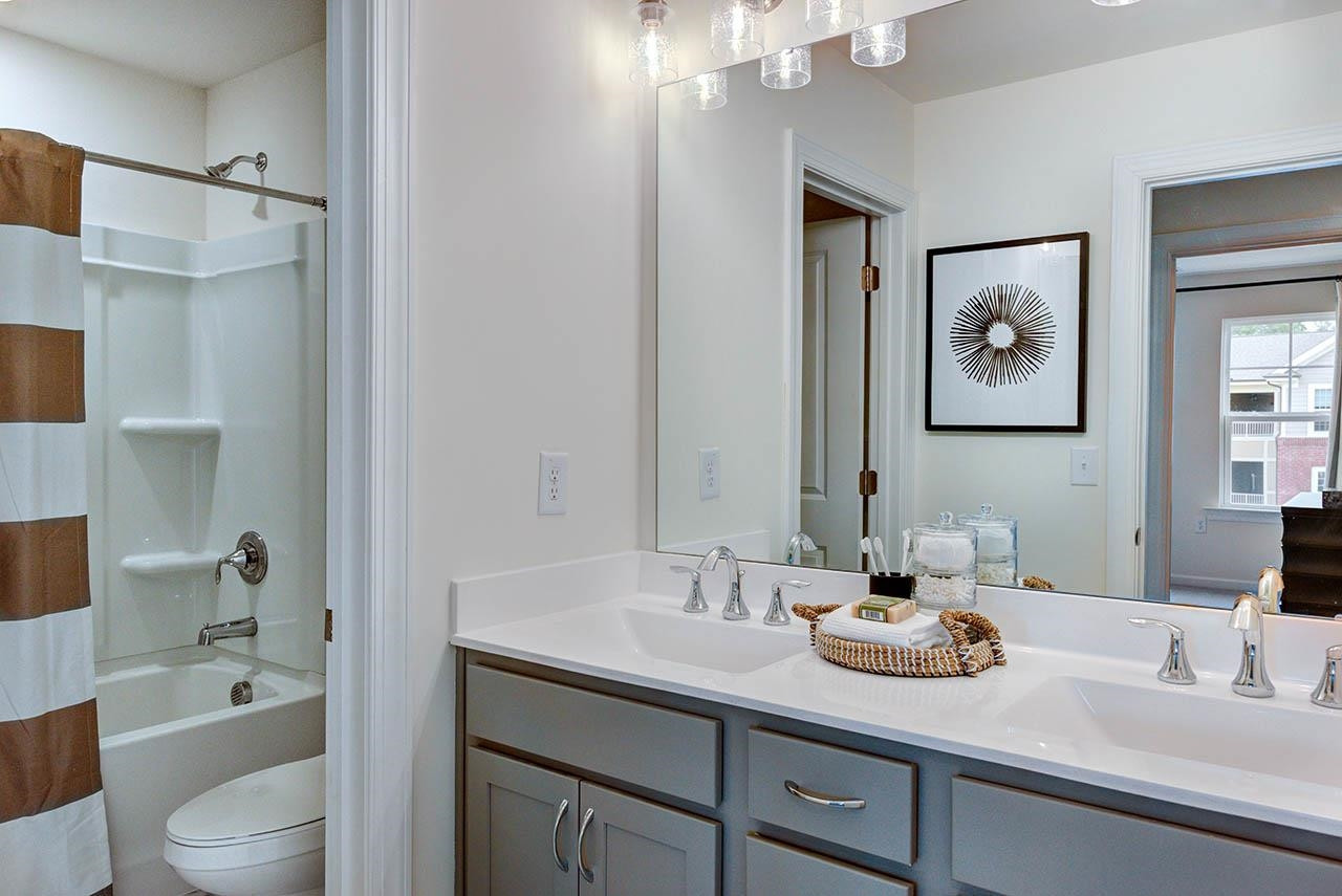 931 Baldwin Rdg Road Apex, NC 27523 - Photo 38 of 42 a bathroom with a sink a toilet and shower