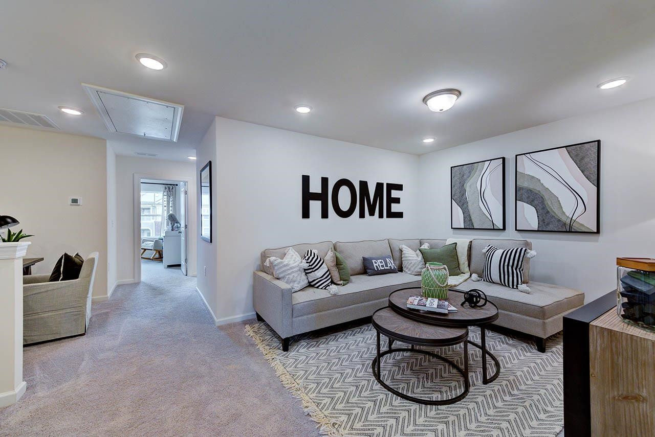 931 Baldwin Rdg Road Apex, NC 27523 - Photo 41 of 42 a living room with furniture and a large window