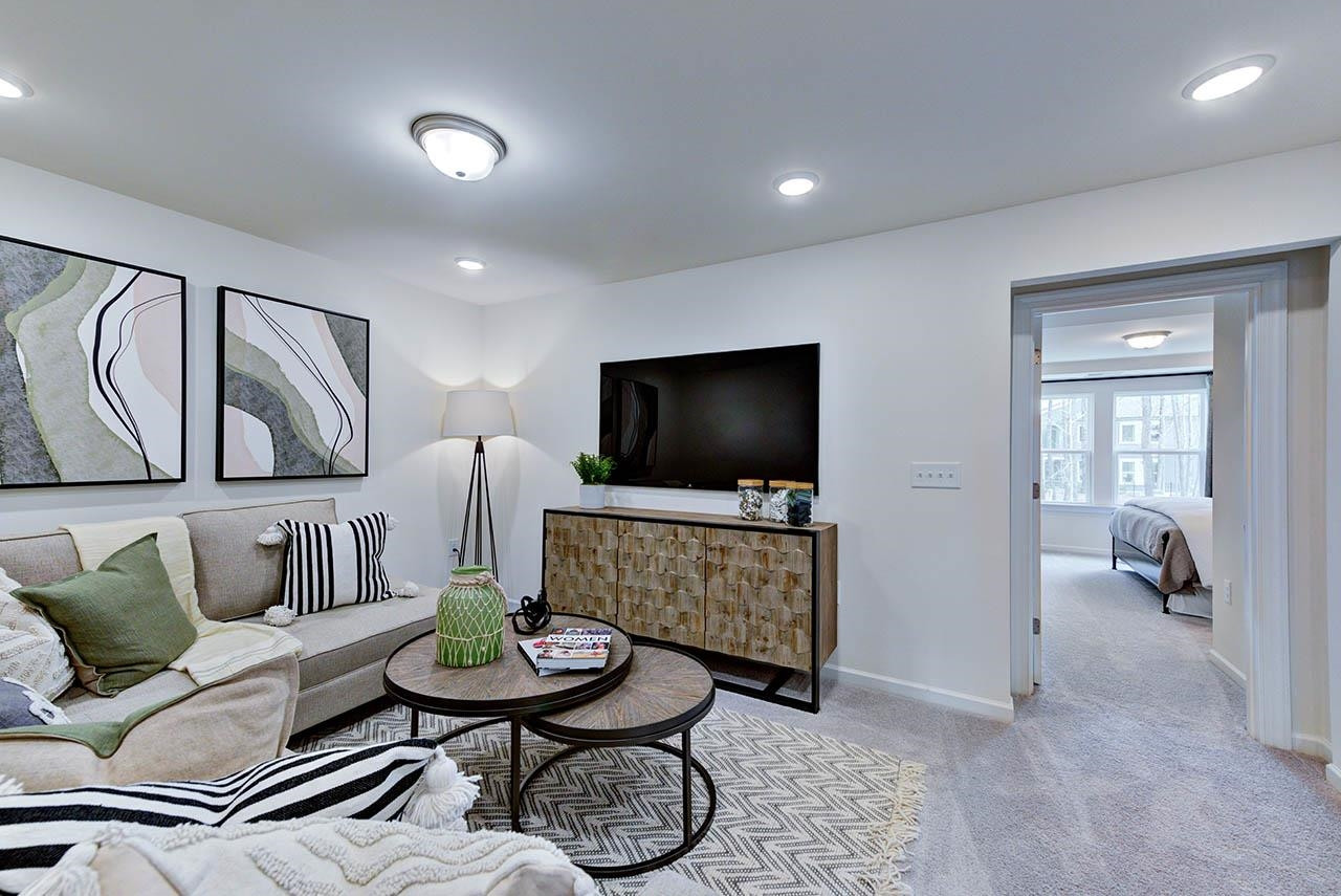 931 Baldwin Rdg Road Apex, NC 27523 - Photo 42 of 42 a living room with furniture and a flat screen tv