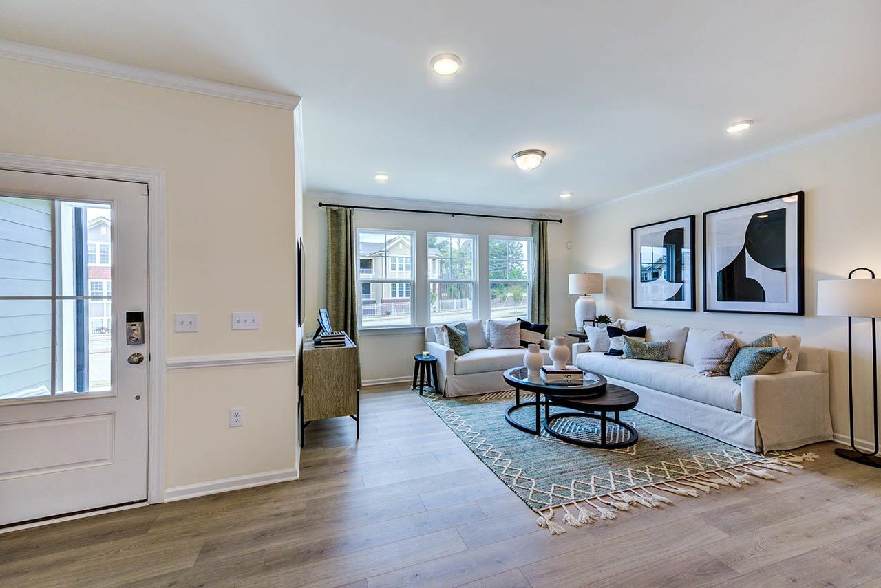 931 Baldwin Rdg Road Apex, NC 27523 - Photo 6 of 42 a living room with furniture and wooden floor