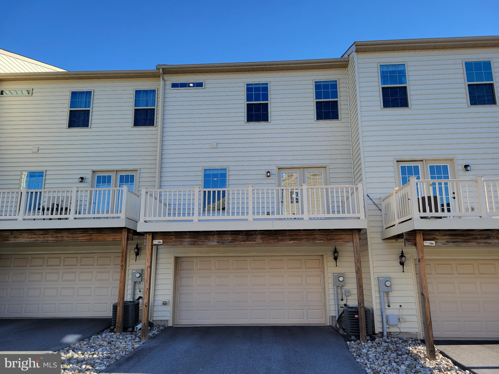 5974 Jefferson Commons Way Frederick, MD 21703 - Photo 14 of 16 a front view of a house with parking space