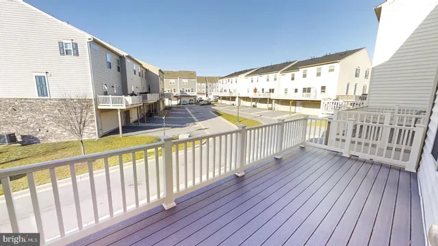 a view of a balcony with wooden floor