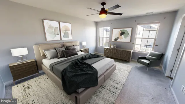 a bedroom with a bed couch and window