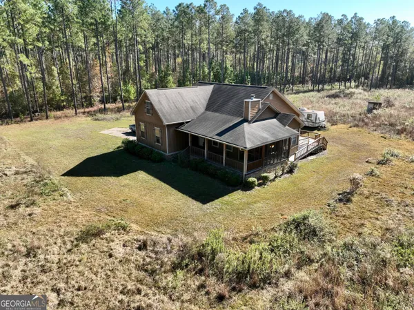 a view of a lake with a yard