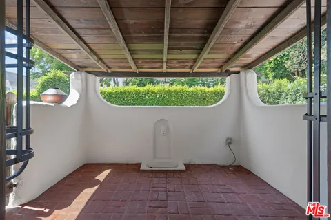 a view of a backyard with a large tree