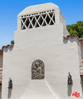 a view of a house with a potted plant