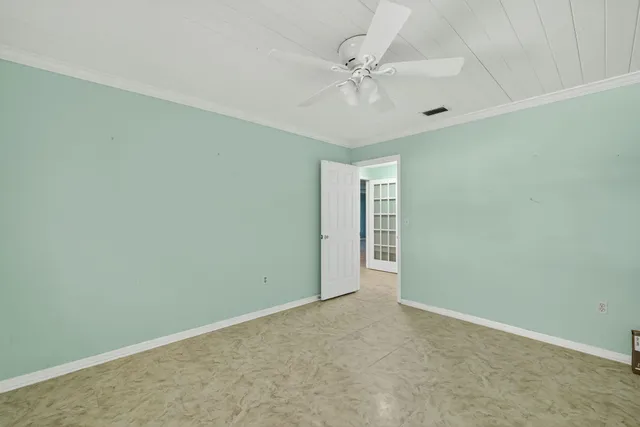 a view of building with yard and ocean view