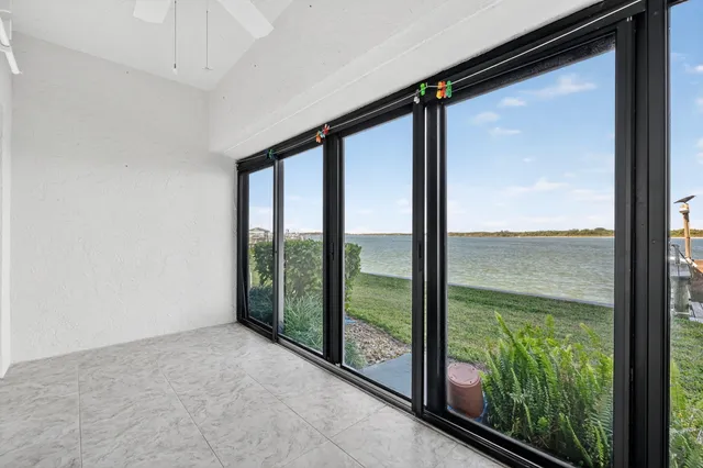 an aerial view of a city with a lake view