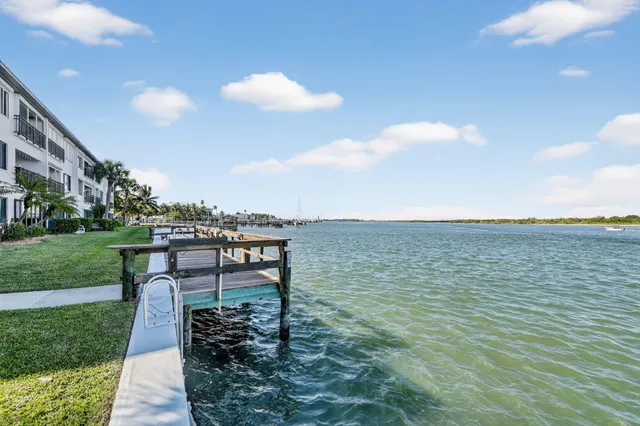 an aerial view of a houses with ocean view