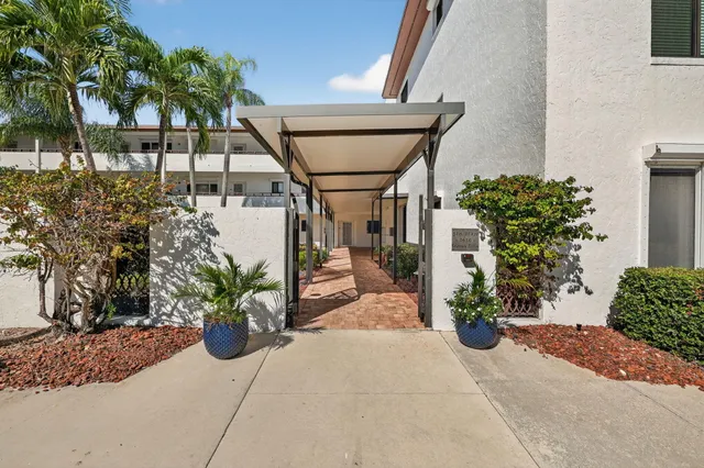 a kitchen with a sink a stove and cabinets