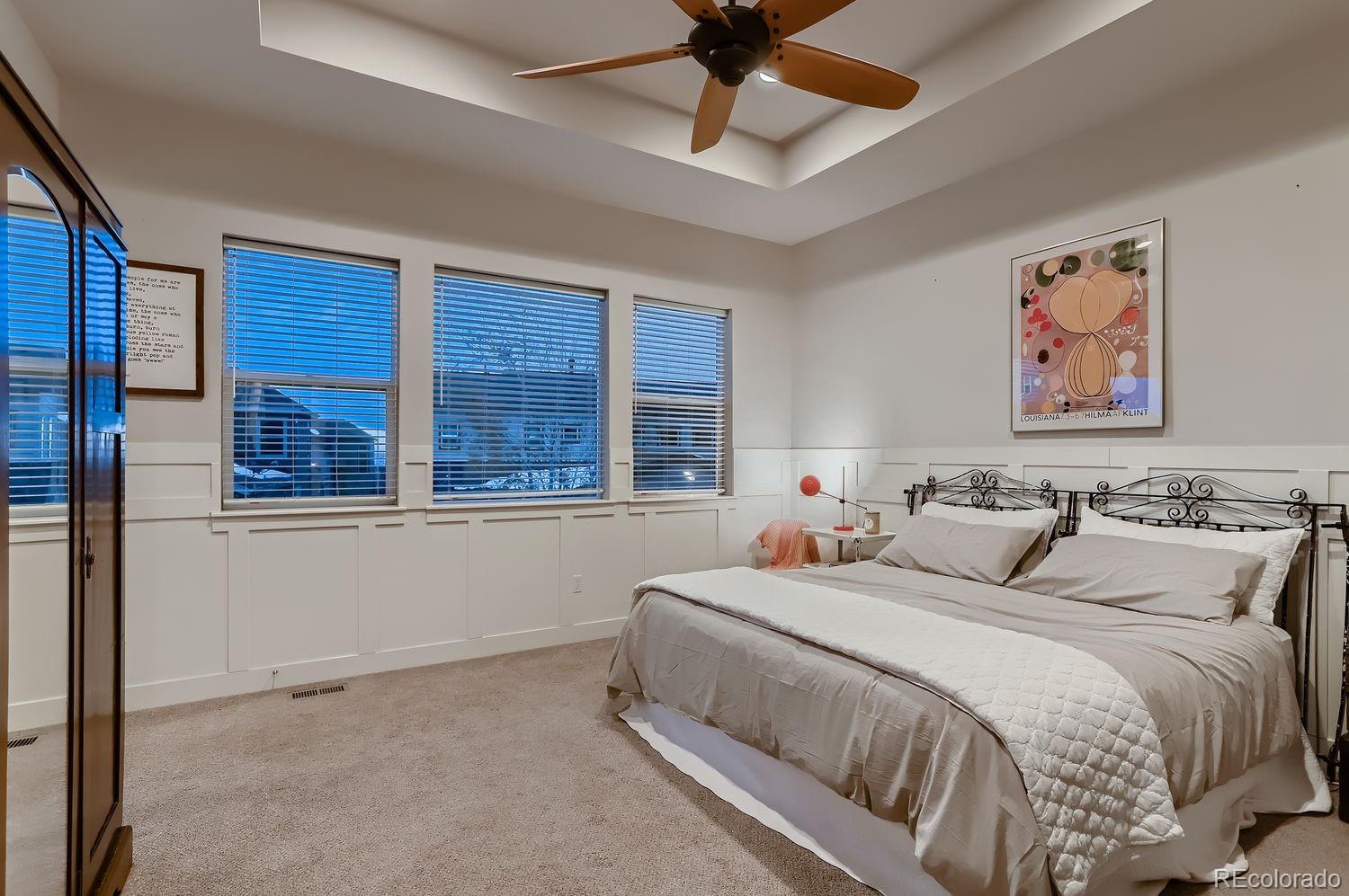 9452 Gore Loop Arvada, CO 80007 - Photo 16 of 30 a bedroom with a bed and a large window