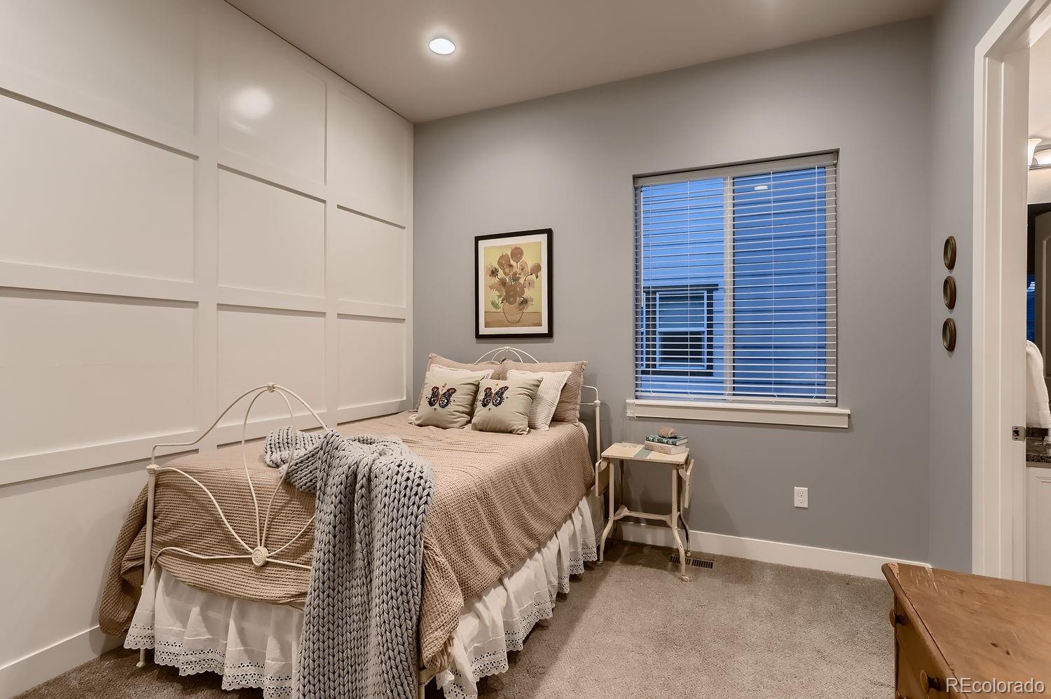 9452 Gore Loop Arvada, CO 80007 - Photo 21 of 30 a bedroom with a bed and a window