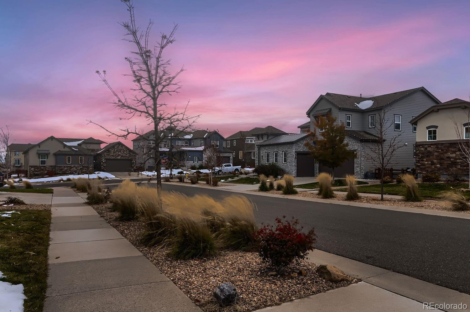9452 Gore Loop Arvada, CO 80007 - Photo 28 of 30 a city street lined with buildings and cars