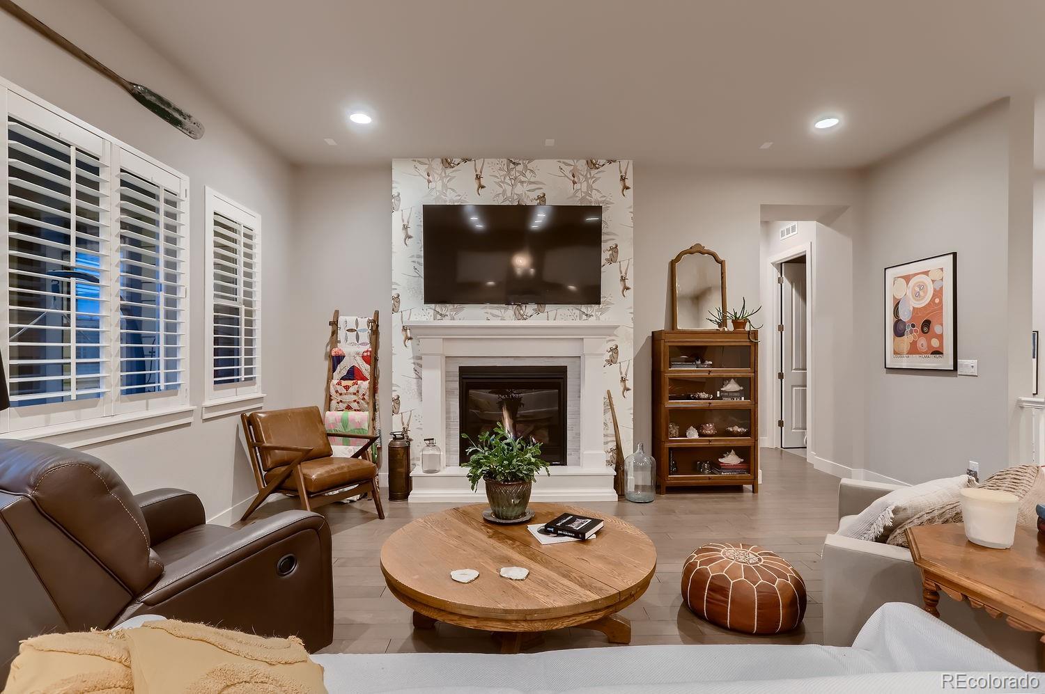 9452 Gore Loop Arvada, CO 80007 - Photo 5 of 30 a living room with furniture and a fireplace