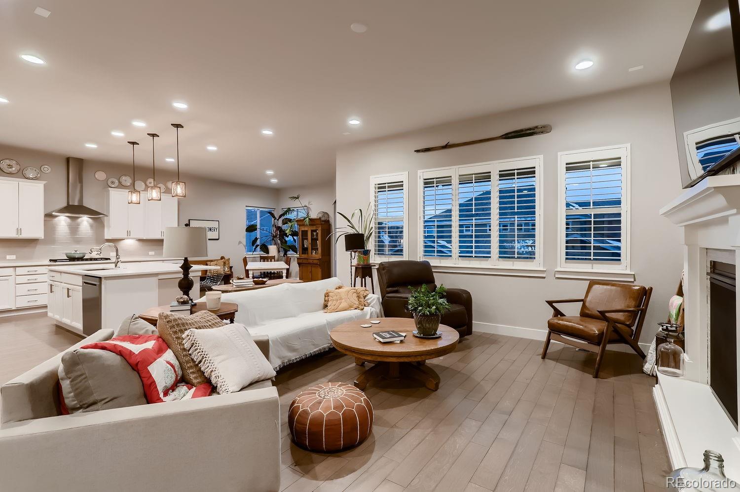 9452 Gore Loop Arvada, CO 80007 - Photo 6 of 30 a living room with furniture and a wooden floor