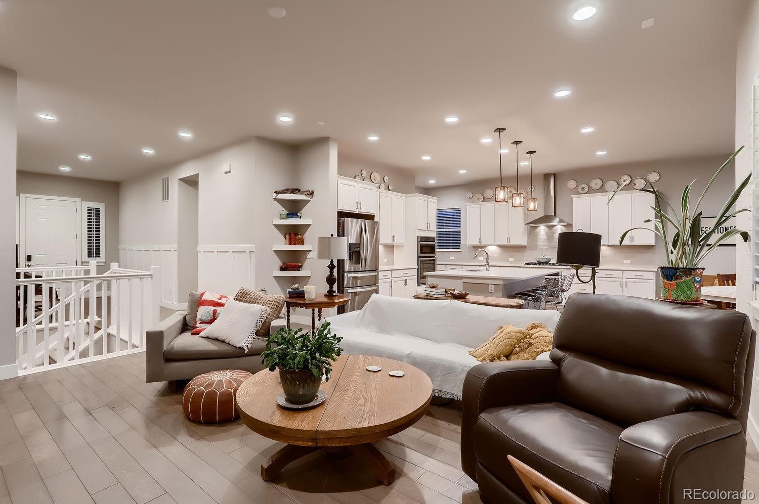 9452 Gore Loop Arvada, CO 80007 - Photo 7 of 30 a living room with furniture kitchen and a table