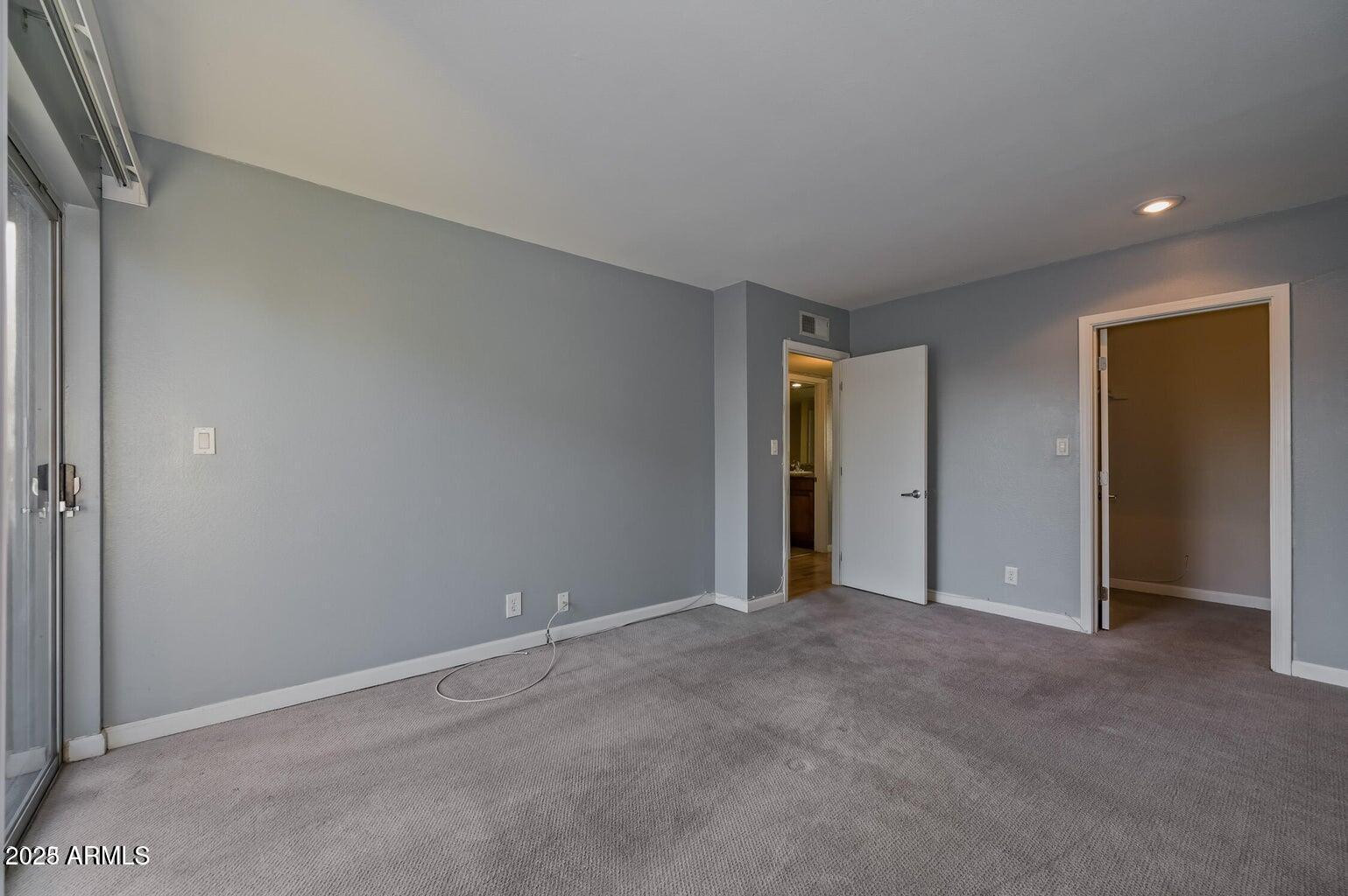 1702 West Tuckey Lane, Unit 212 Phoenix, AZ 85015 - Photo 17 of 20 a view of an empty room