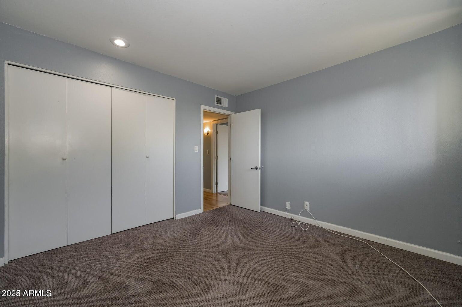 1702 West Tuckey Lane, Unit 212 Phoenix, AZ 85015 - Photo 19 of 20 a view of an empty room