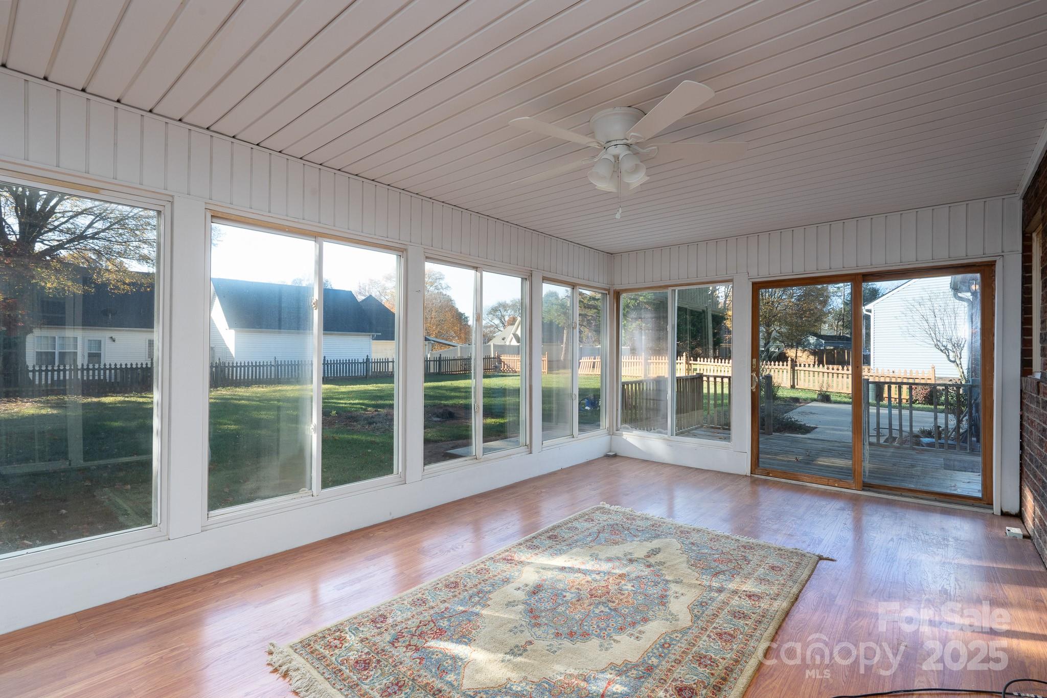 621 Peacehaven Road Kannapolis, NC 28083 - Photo 17 of 44 a view of a big room with wooden floor and windows