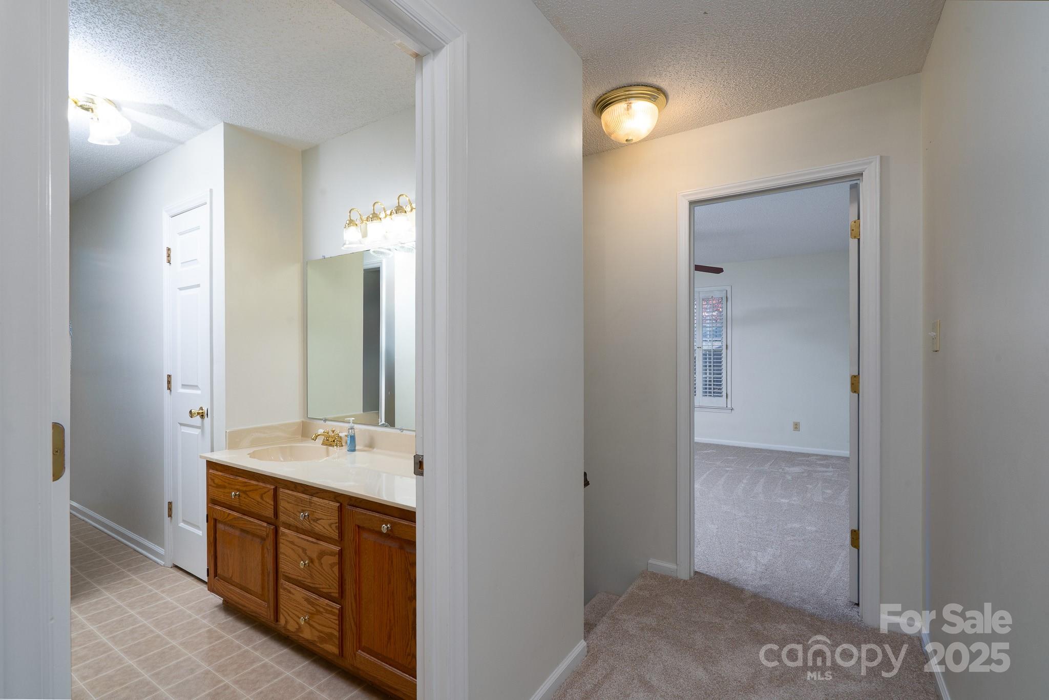 621 Peacehaven Road Kannapolis, NC 28083 - Photo 22 of 44 a spacious bathroom with a double vanity sink a mirror and a