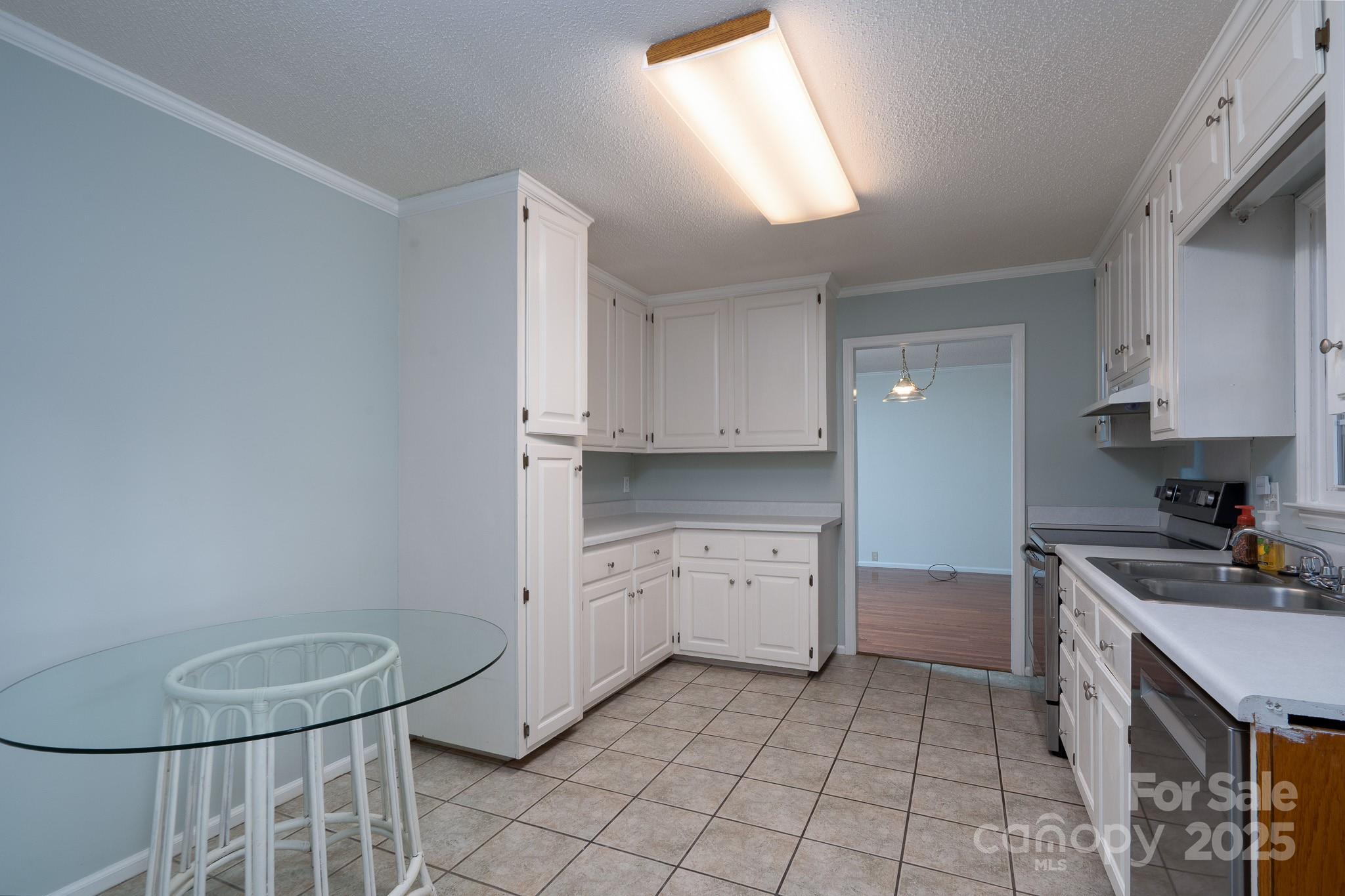 621 Peacehaven Road Kannapolis, NC 28083 - Photo 29 of 44 a kitchen with a sink a stove and cabinets