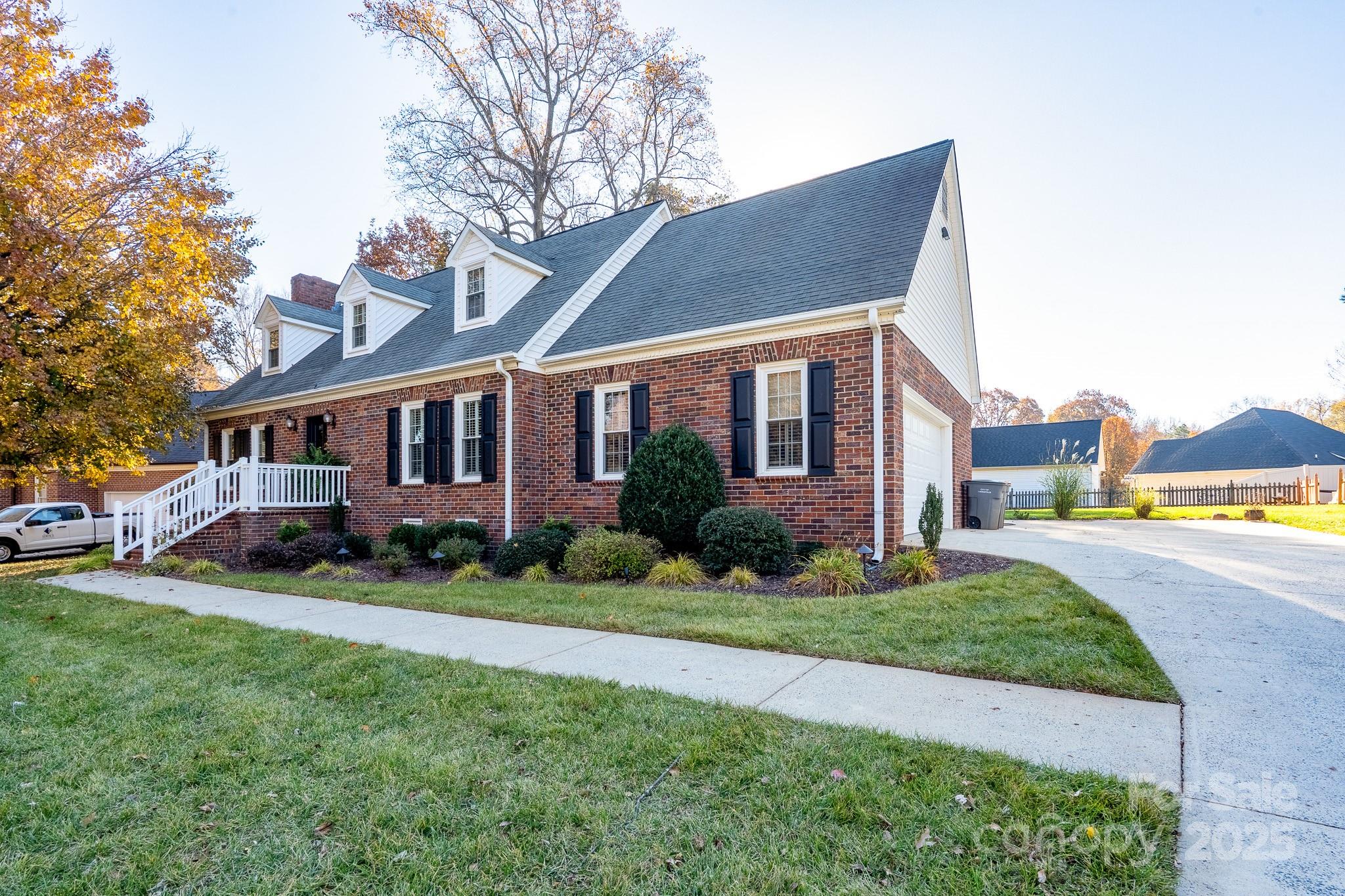 621 Peacehaven Road Kannapolis, NC 28083 - Photo 3 of 44 a front view of a house with a yard table and chairs