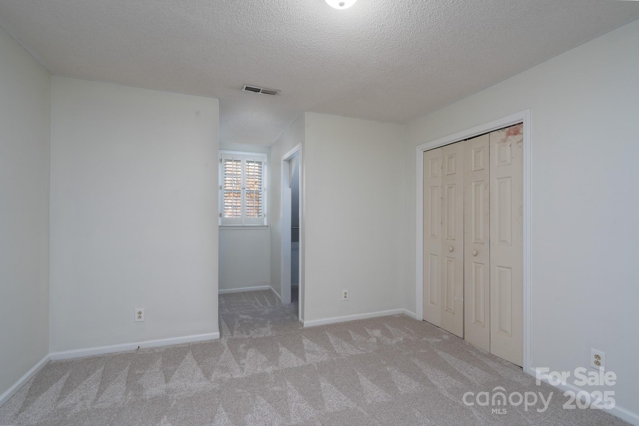 621 Peacehaven Road Kannapolis, NC 28083 - Photo 33 of 44 a view of an empty room and a window