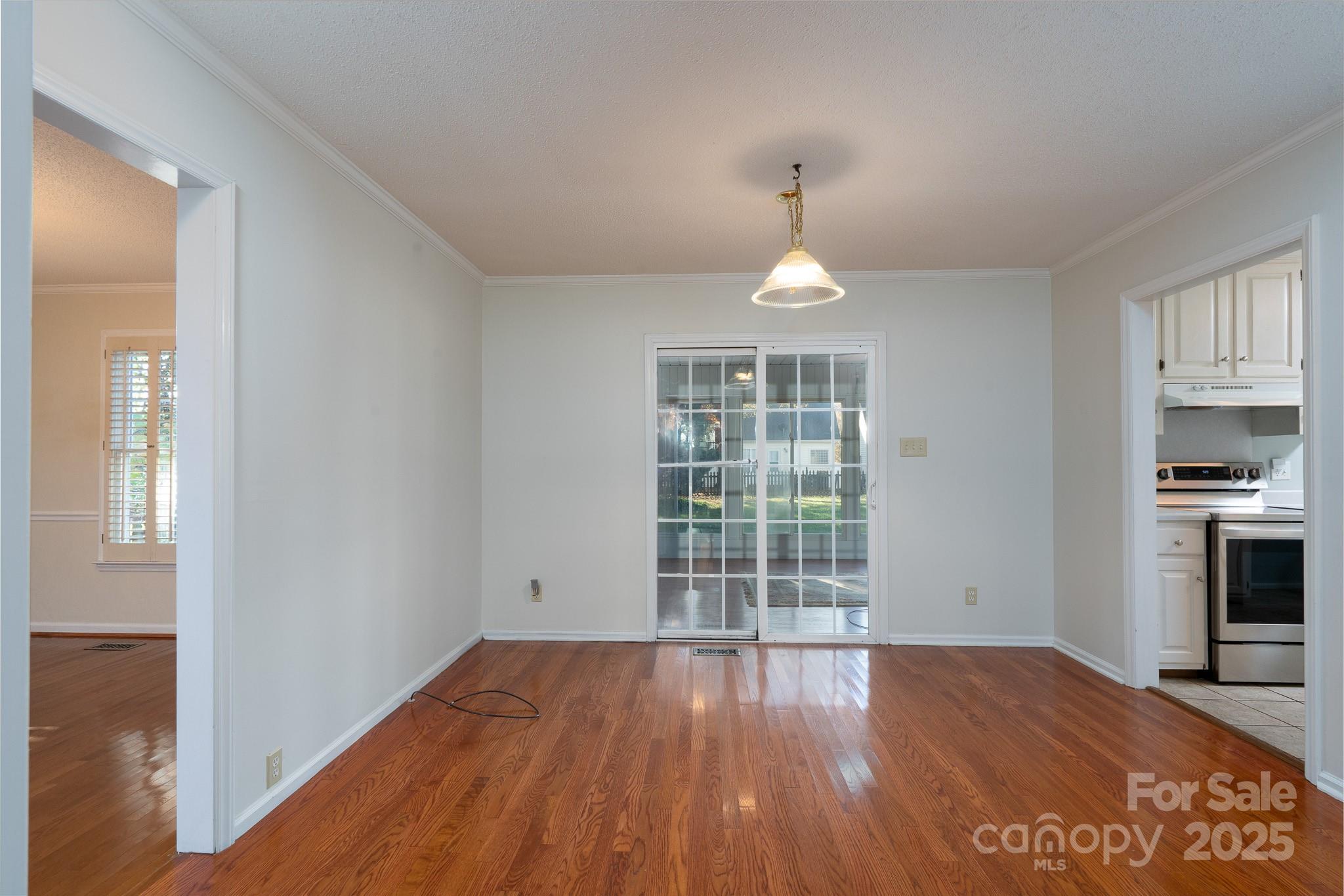 621 Peacehaven Road Kannapolis, NC 28083 - Photo 37 of 44 wooden floor in an empty room with a window