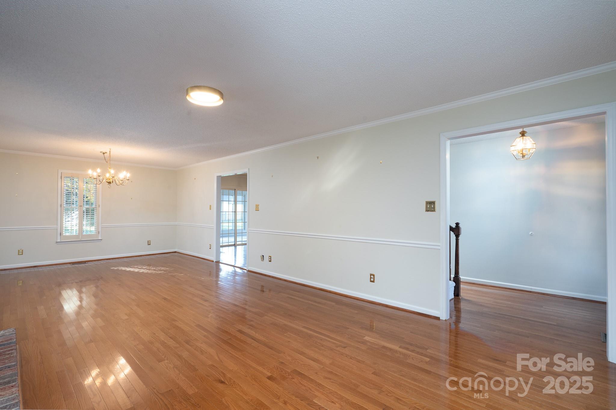 621 Peacehaven Road Kannapolis, NC 28083 - Photo 42 of 44 wooden floor in an empty room with a window
