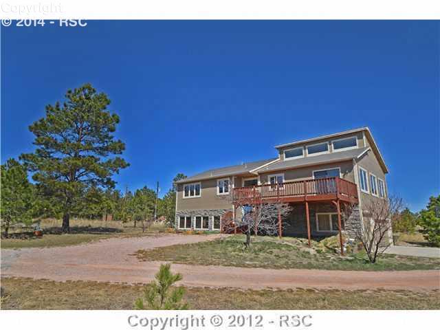 8660 Shoup Road Colorado Springs, CO 80908 - Photo 2 of 16 LOTS OF SUNSHINE & PRIVACY ON THIS LOVELY LOT- A NICE MIX OF MEADOW & MATURE PONDEROSA PINE TREES.