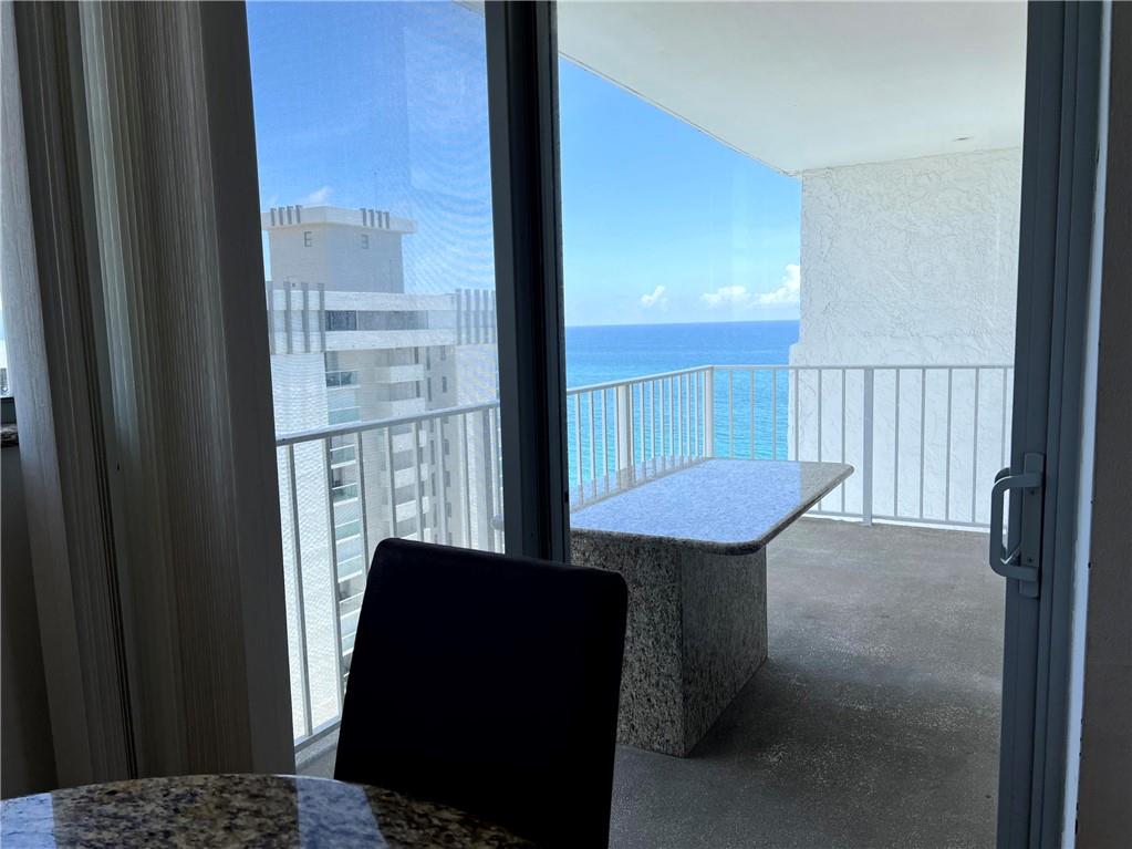 1010 South Ocean Boulevard, Unit PH12 Pompano Beach, FL 33062 - Photo 11 of 47 a view of a balcony with chair and table