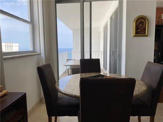 a view of a workspace with furniture