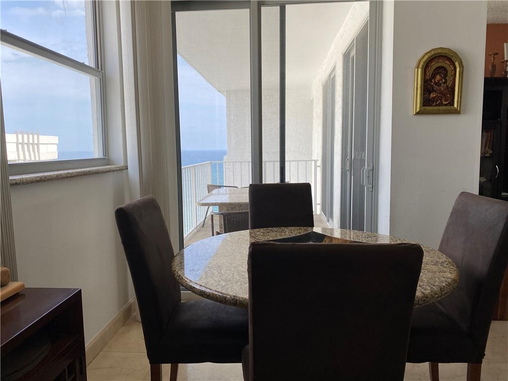 1010 South Ocean Boulevard, Unit PH12 Pompano Beach, FL 33062 - Photo 13 of 47 a view of a workspace with furniture and window