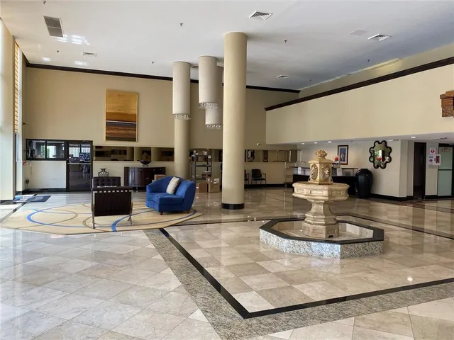 a front view of a house with a garden and yard