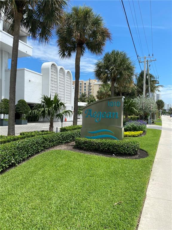 1010 South Ocean Boulevard, Unit PH12 Pompano Beach, FL 33062 - Photo 37 of 47 a front view of a house with a garden and yard
