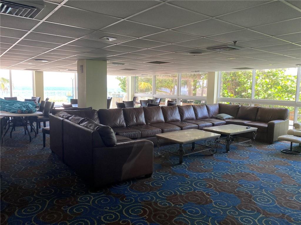 1010 South Ocean Boulevard, Unit PH12 Pompano Beach, FL 33062 - Photo 40 of 47 a living room with furniture and a large window